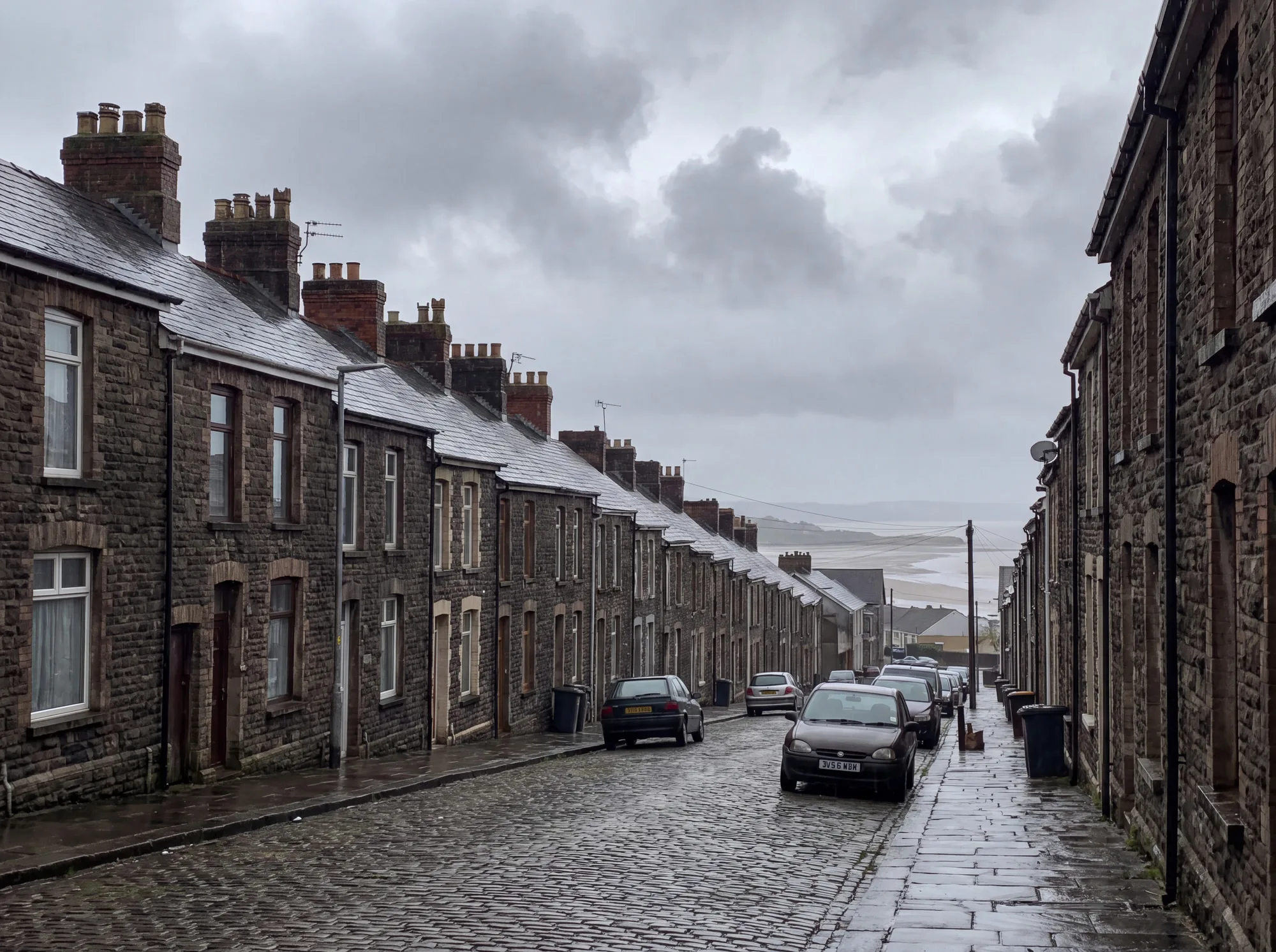 Slate rooftops and chimney stacks across a Welsh coastal town