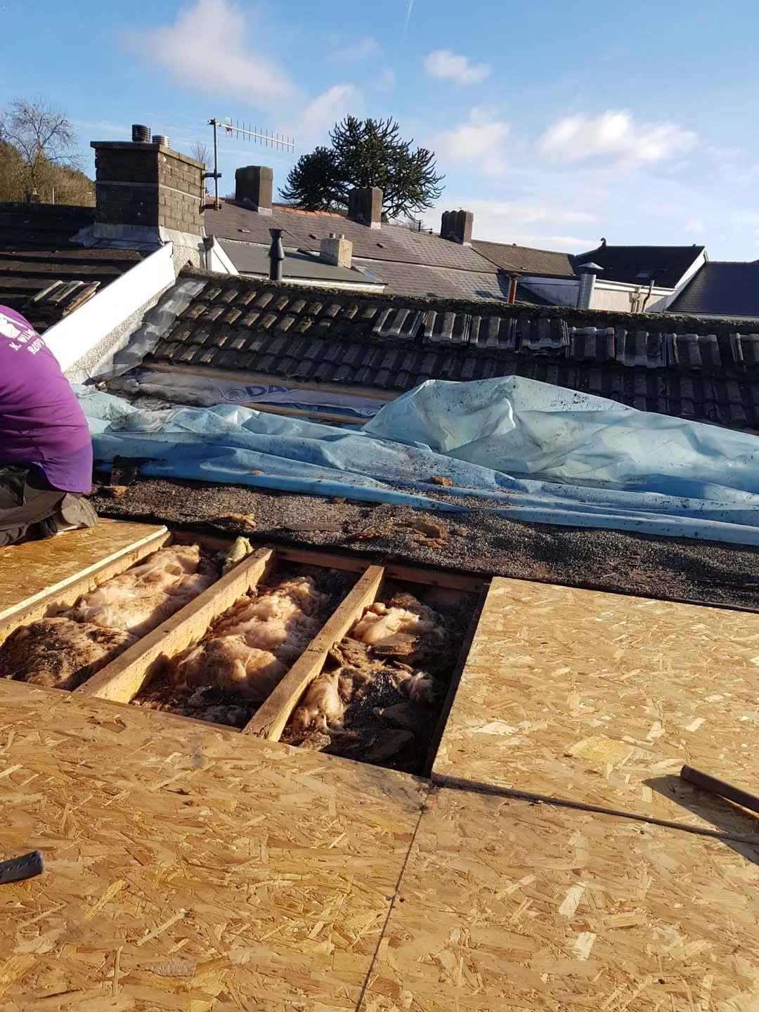 Flat roof stripped back with new OSB decking boards going down over the joists